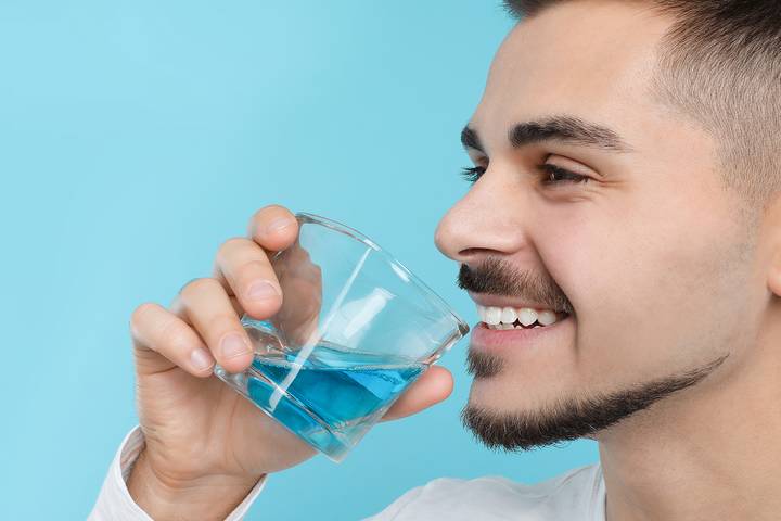 You should use mouthwash after dental implant surgery.